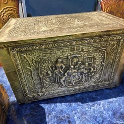 vintage embossed brass and wood coal box, also known as a coal scuttle or tinder box