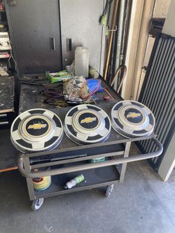 Three Chevy dog dish caps.