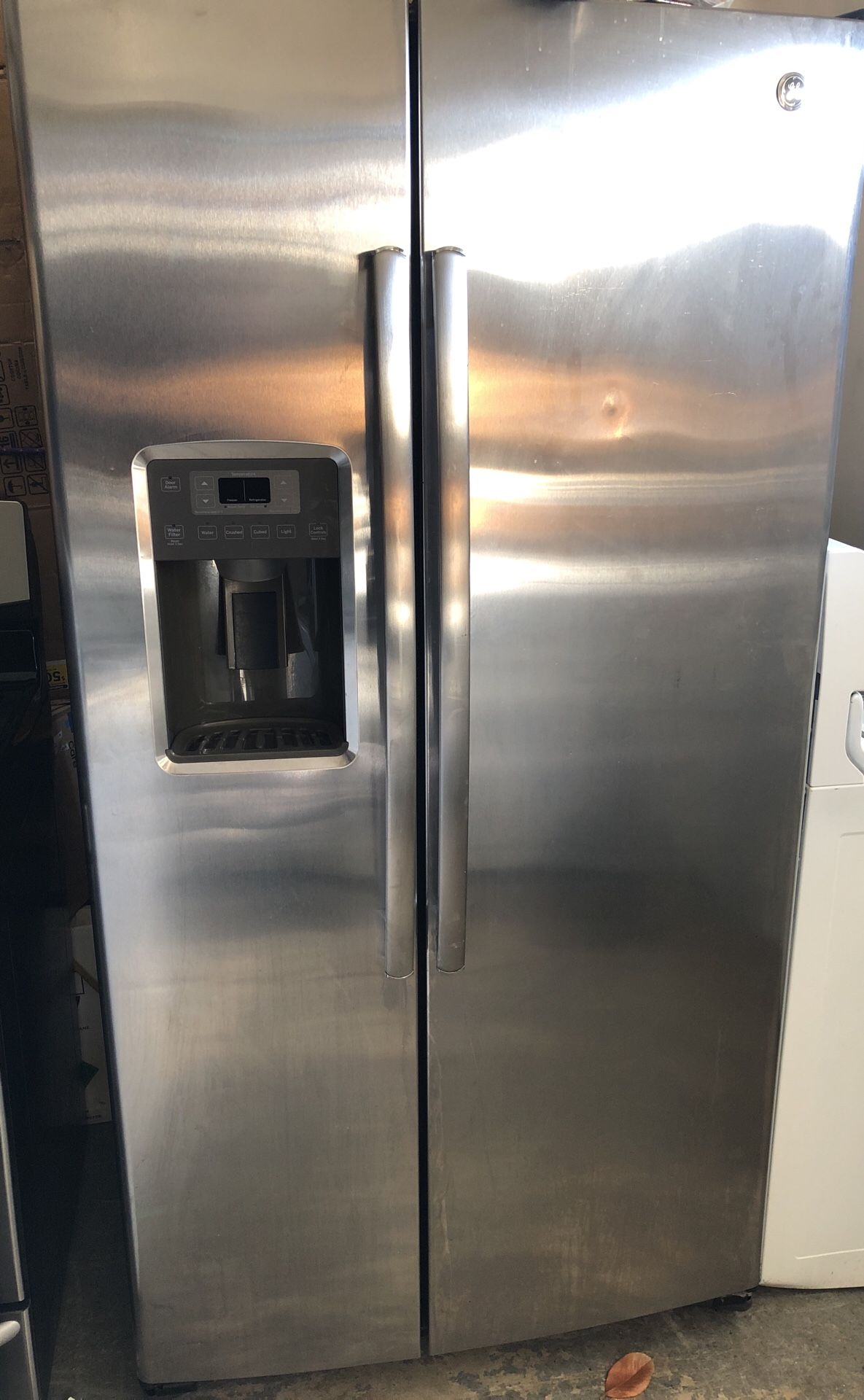 GE refrigerator side by side with ice maker