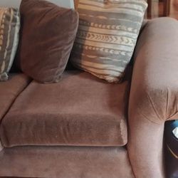 Brown living room, set couch, love seat, and foot rush