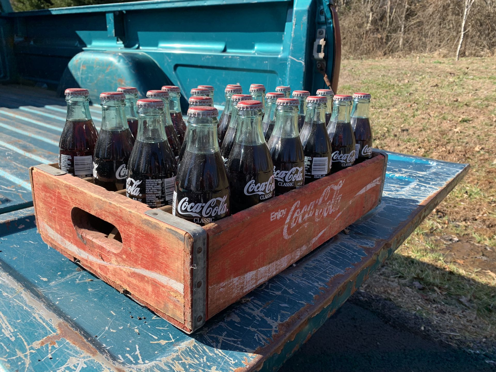 Coca Cola bottles and case