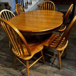 Wood dining room table with chairs set