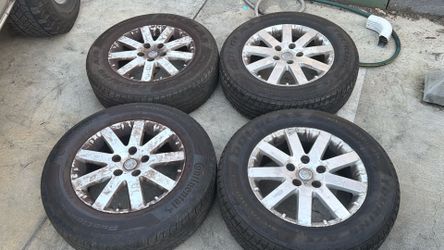 Chrysler Town and country 17 Inch aluminum wheels with two good tires. Fits Dodge