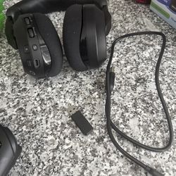 Newest wireless Bluetooth headset with connector and power cord.
