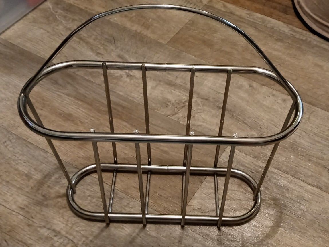 Silver magazine rack