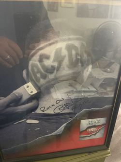 Autographed AC/DC Photo With Guitar Pick And Concert Ticket From 2008