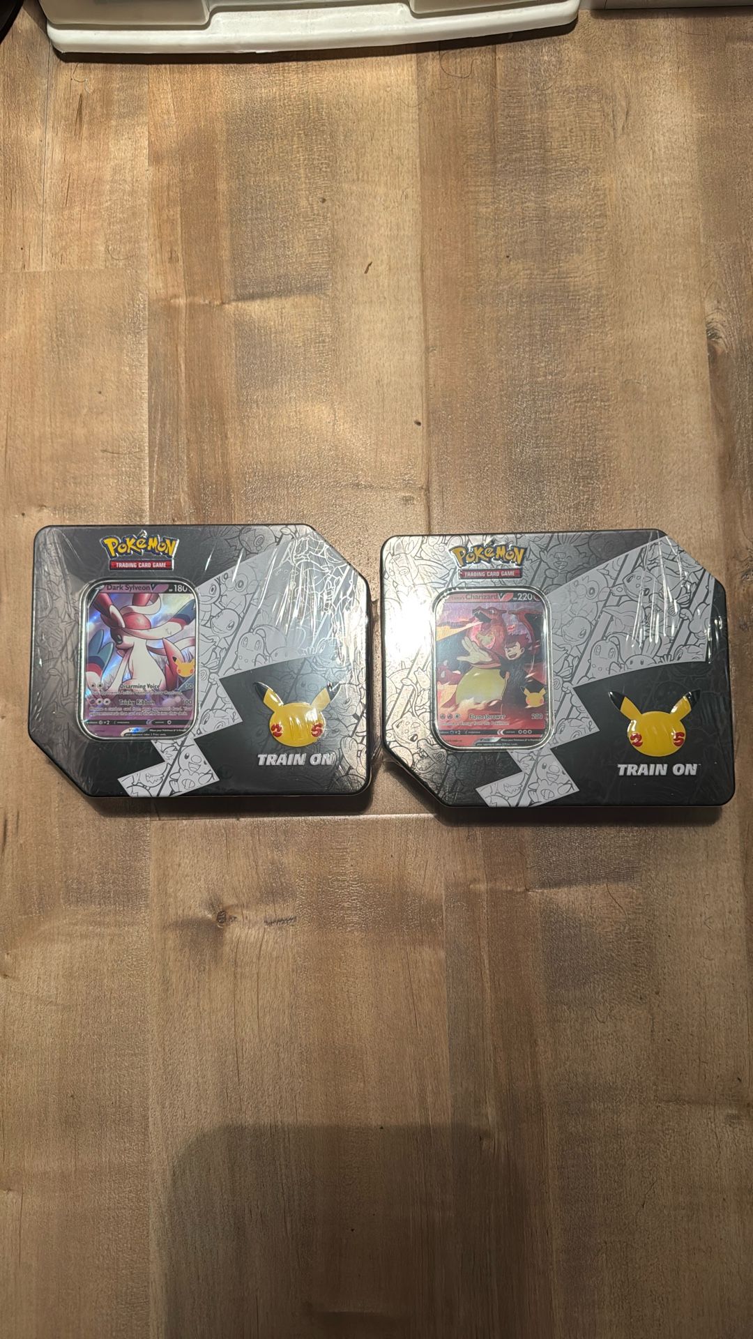 Pokémon 25th Anniversary Tins Sylveon and Charizard (Walgreens Exclusive)