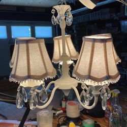 White metal crystal chandelier with shades