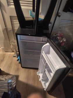 Recliner and a mini fridge