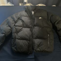 new black nike puffer 