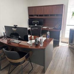 Office desk with cabinet and drawers.