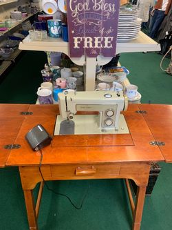 Vintage seeing machine and table
