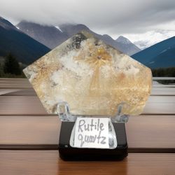 Rutilated Quartz specimen with golden needles, known for its natural beauty and healing properties. This unique crystal 