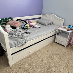 Three twin size beds with mattresses