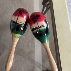 🪘 Hand-Painted Wooden Maracas - $15 Add some rhythm to your music or a tropical touch to your home decor!
