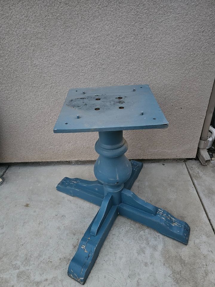 Round wooden table with refinished base