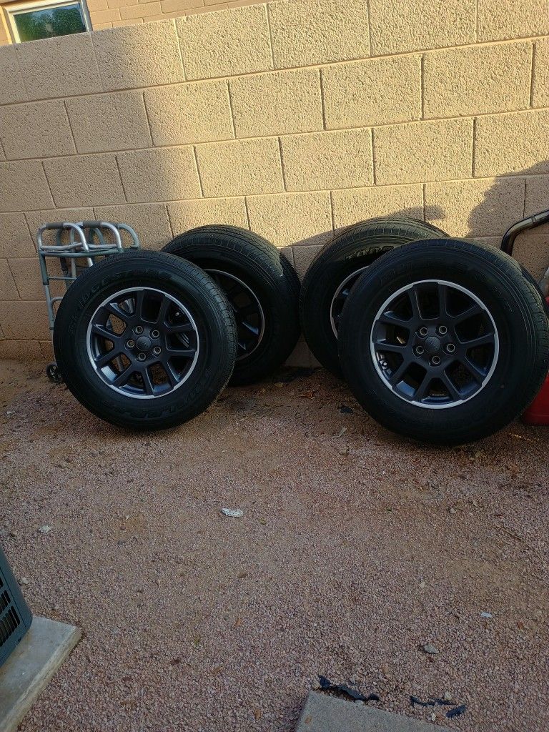 Set Of 4. Bridgestone 255/70R18 Tires And Rims And Lug Nuts