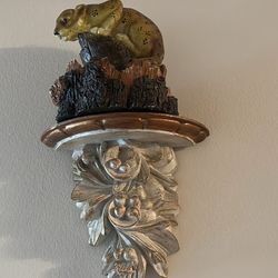 Ornate wall sconces with candels