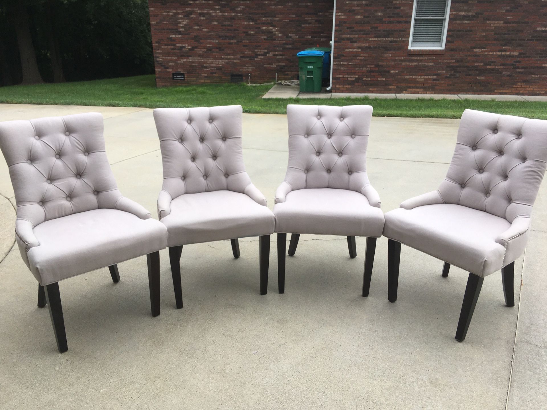 Selling four gray chairs with nail heads