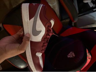 Air Jordan’s 1 low cherrywood red/ Cement grey