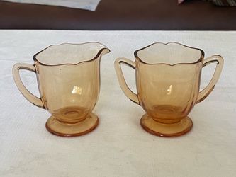 Vintage New Martinsville amber glass creamer and sugar set.