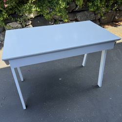White desk with blue drawer