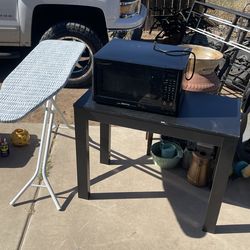 black microwave, black table, white item