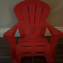 Kids Red Outdoor Plastic Chair Looks like an Adirondack chair