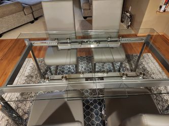 Extendable Glass Dining Table With Slight Damage To Underneath