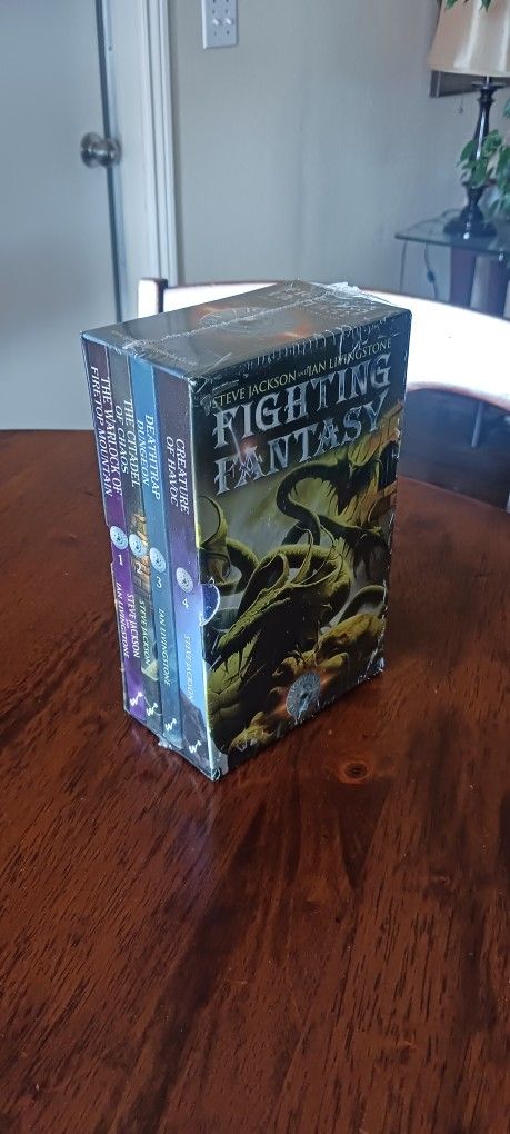 Fighting Fantasy Gamebook Set Books 1-4 With Sleeve Sealed.
Roll dice, fight monsters, find treasure, map your progress