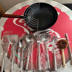Wok Pan Frying With Kitchen Tools Spatulas Chopsticks Etc.