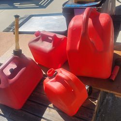 4 plastic gas cans, different sizes