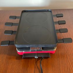 An electric raclette party grill