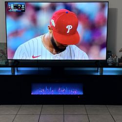🔥 Modern LED Fireplace TV Stand + 65″ 4K Fire TV – High Gloss, LIKE NEW– $1,200 (Palm Desert)