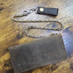 Brand new hand crafted genuine leather Bi Fold wallet with 24" stainless steel chain.

$75 FIRM