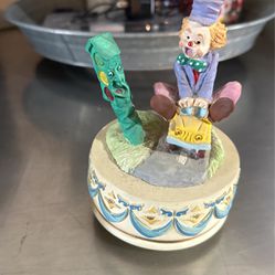 Vintage Music Music Box Clown Seeing On Top Of A Car In Front Of A Traffic Light