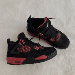 Thunder red Jordan 4s 