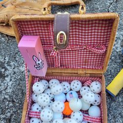 PICNIC BASKET FULL OF GOLF BALLS