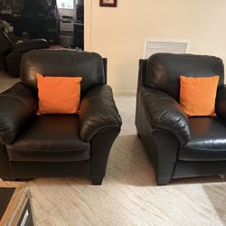 Beautiful Genuine, leather Sofa, plush chairs and solid wood accessories.