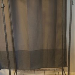 Sturdy clothes rail with shelves and wheels