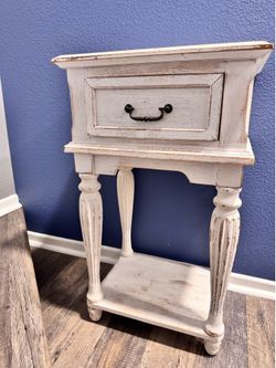 Distressed side table with drawer