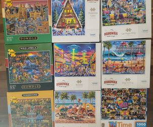 Set of 9 - 1000 piece puzzles