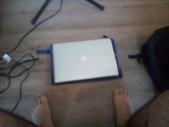 Fixer-upper MacBook with Blue Spiderman case