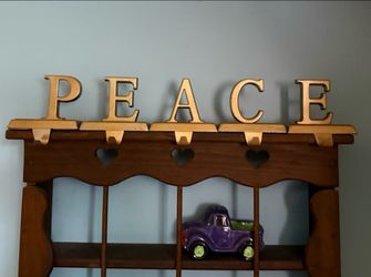 PEACE shelf sitting Letters with hooks   Gold  metal like color in a matte finish  Great shape   I do bundle thanks