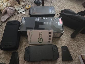 Lenovo Legion Go 1 TB + Multiple Cases + Controller Dock + Tempered Glass Screen Protector + Box and Accessories