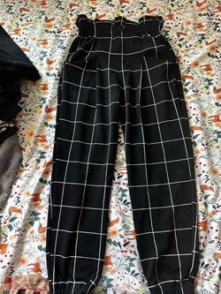 black and white grid-patterned trousers