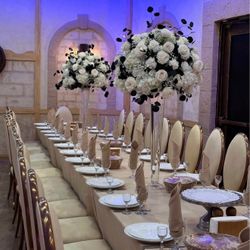 Big Black And White Flower Centerpieces On A Tall Glass Vase