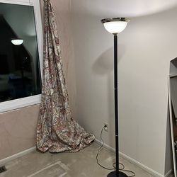 Black floor lamp with gold accents