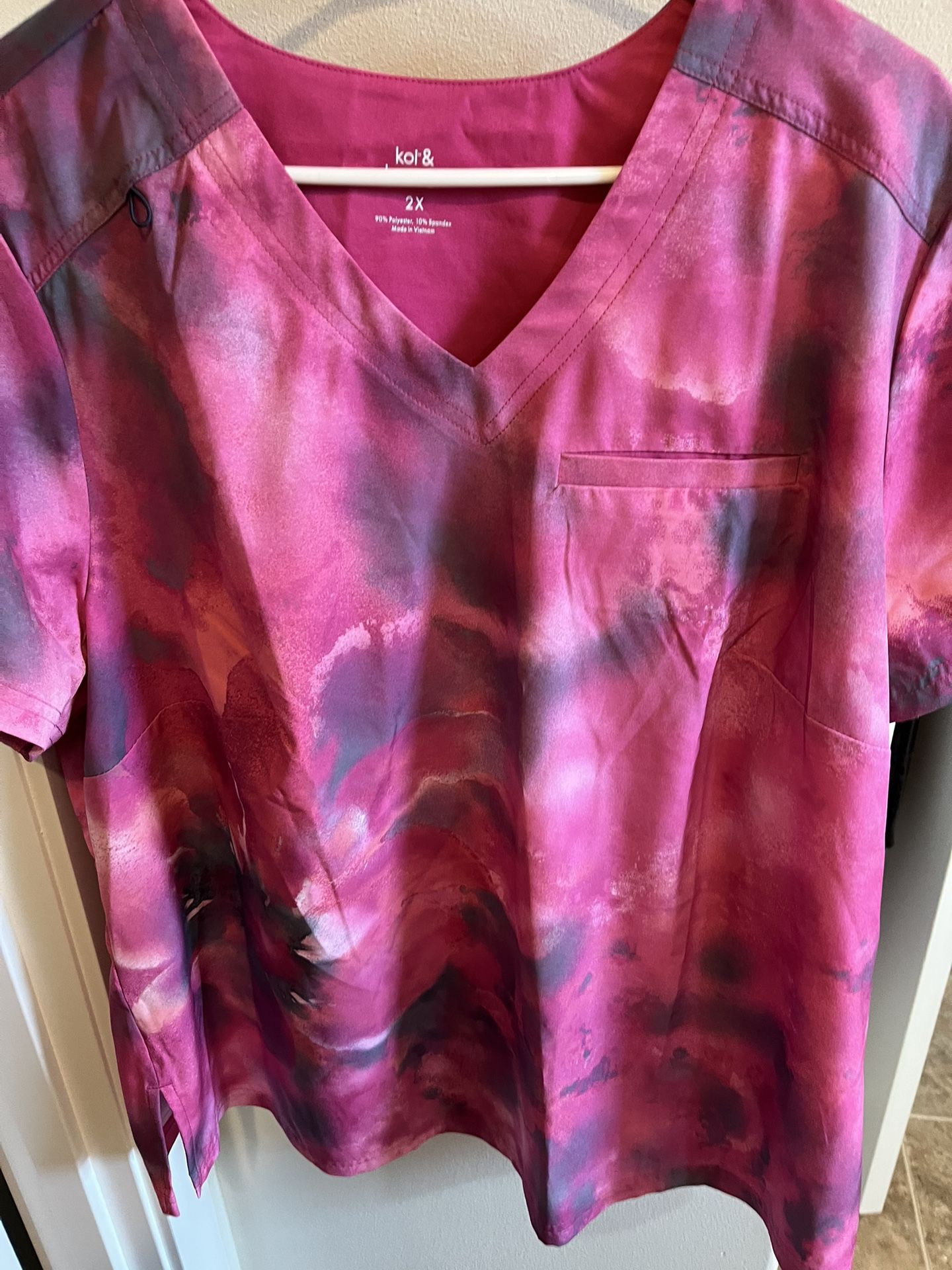 Scrub top. New. Never Worn. Tags Still Attached. Size 2 XL