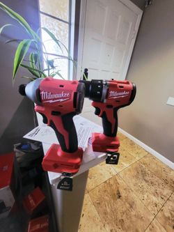 Milwaukee M18 18-Volt Lithium-Ion Brushless Cordless Compact Hammer Drill/Impact tool only no batteries or charger included.